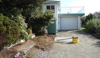 The corner of my house, showing the garage and sundeck, which faces the ocean.