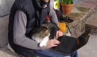 Filip in Sardinia, with one of the looked-after cats